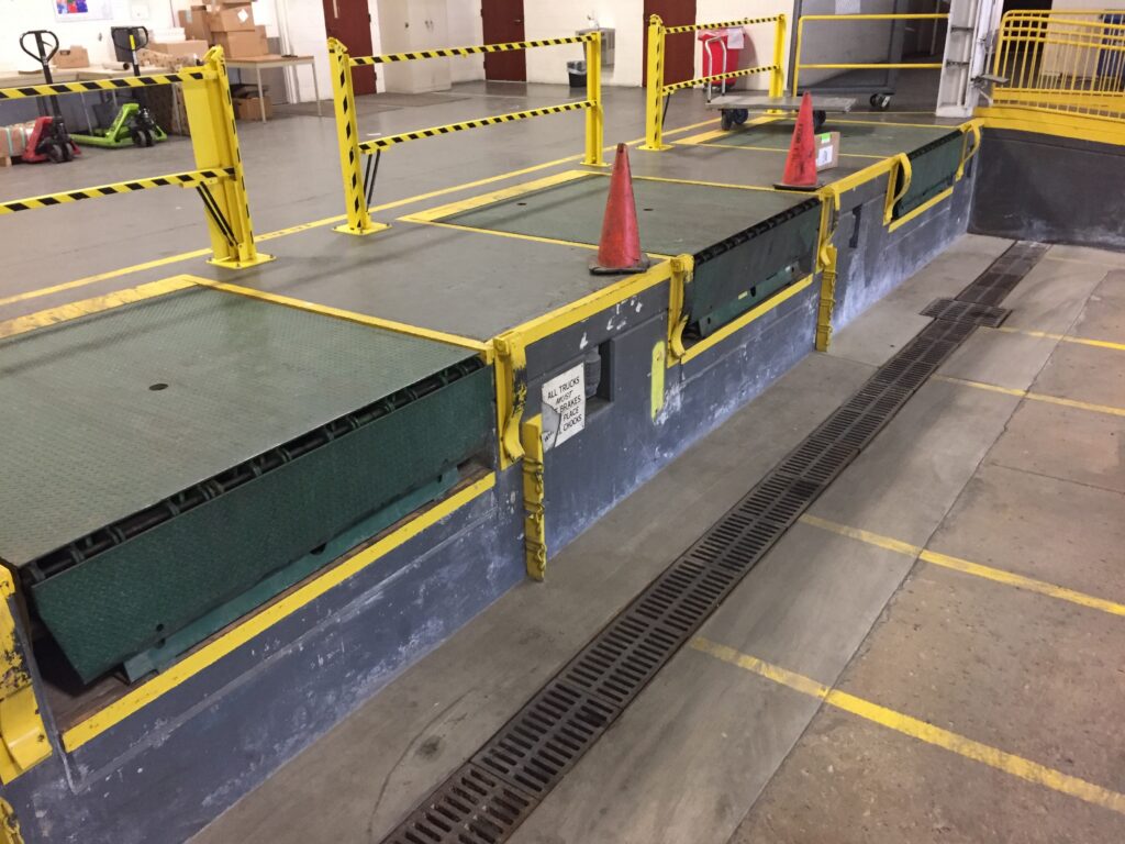 Steel grating helping with drainage inside of a truck loading bay